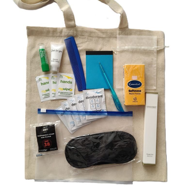 Lots of comfrot items including an eye makes, ear plugs, tissues, wipes, hand lotion and a dental kit.
